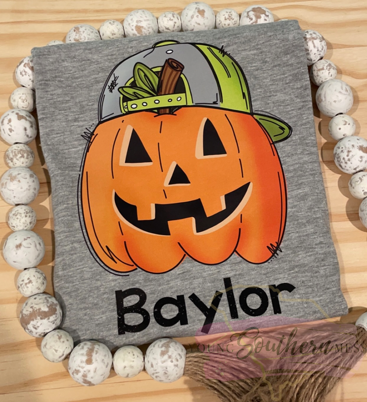 cool pumpkin shirt with backwards hat 